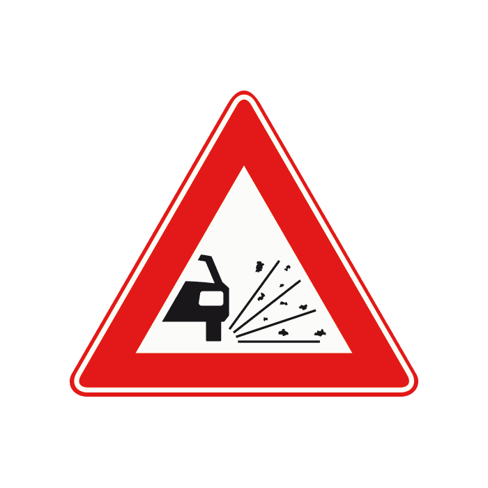J25 - Loose Chippings road sign